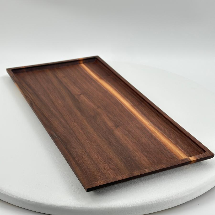 walnut tray angular view shines a beautiful light on this gorgeous hand crafted piece.