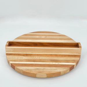 Wooden cutting board with a handle on a white background