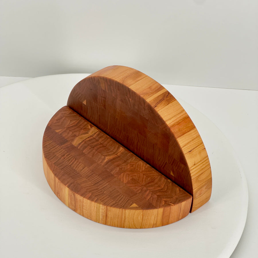 Wooden cutting board with a unique design on a white surface